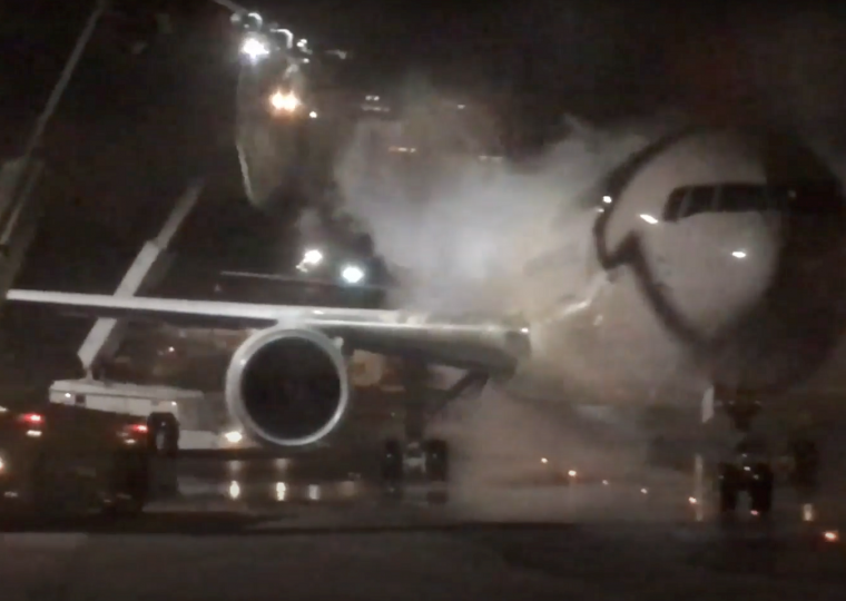 Airplane being sprayed with anti-ice
